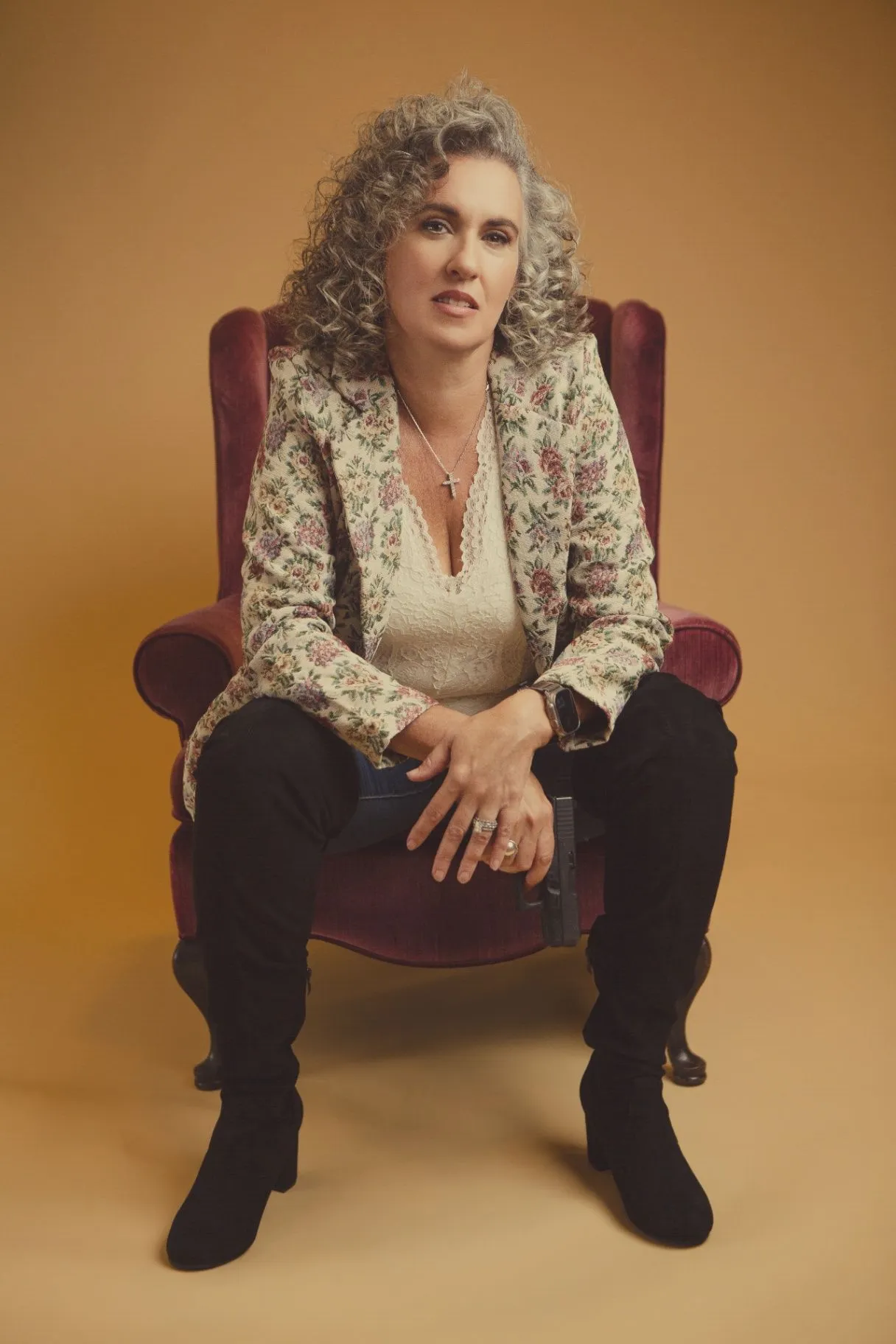 Buffy Payne seated for a warm professional portrait